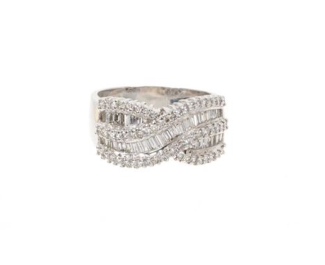 Diamond ring, the wide band with two rows of baguette cut diamonds flanked by brilliant cut diamond border in a crossover des