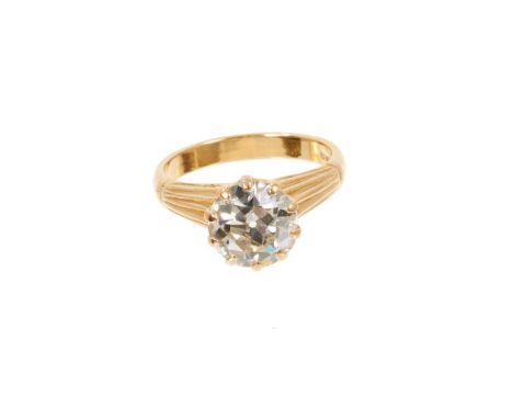 Diamond single stone ring with an old cut diamond estimated to weigh approximately 2.05cts, in a claw setting on reeded gold 