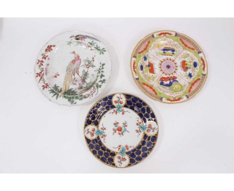 An 18th century Chelsea plate, decorated with exotic birds, together with two Worcester plates (3)The Chelsea plate has signi