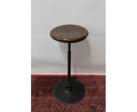 Vintage elm seated machinists stool, with rising adjustable seat on spread base, 56cm highA couple of inset plugs to top may 