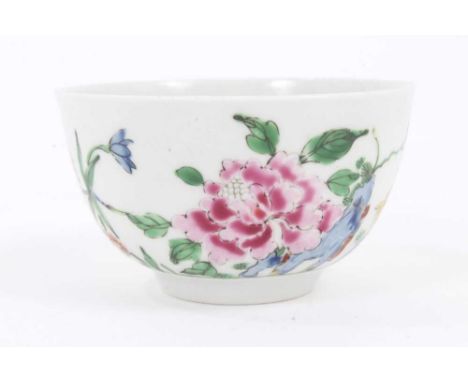 An unusual Worcester tea bowl, circa 1755-56, polychrome painted in the Chinese famille rose style with flowers and insects, 