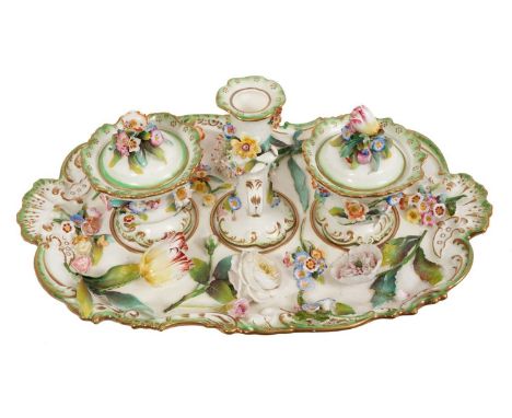 A 19th century English Coalbrookdale-type inkstand, including inkwells and a candlestick, with floral encrusted decoration, s