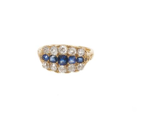 Late Victorian sapphire and diamond ring with a line of five graduated mixed cut blue sapphires flanked by ten old cut diamon