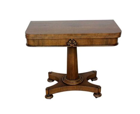 Regency mahogany card table, the rounded rectangular fold over top with green inset baize and well below, on flared facetted 
