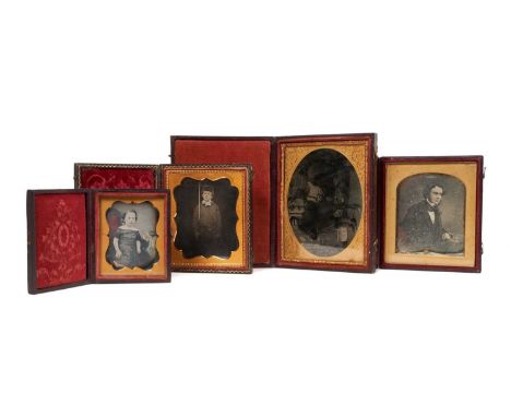 Four mid-19th century daguerreotypes in fitted leather cases, the largest an oval picture of a boy and horse, total size 12 x