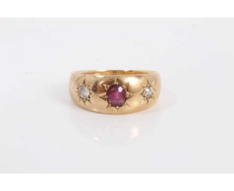 Edwardian 18ct ruby and diamond three stone gypsy ring with central round mixed cut ruby flanked by one brilliant cut and one