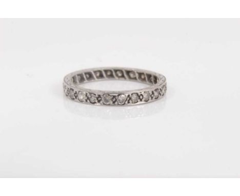 Diamond eternity ring with a full band of twenty four brilliant cut diamonds. Ring size NWeight 2.6 grams 
