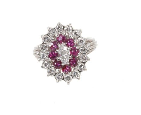 Ruby and diamond cluster ring with a central marquise cut diamond surrounded by mixed cut rubies and 16 brilliant cut diamond