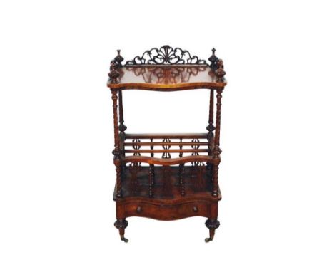 Victorian walnut canterbury whatnot, of serpentine form with pierced gallery and shelf raised on spiral carved supports with 