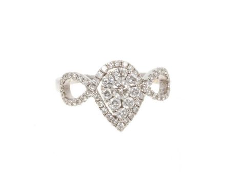 Diamond cluster ring with a pear shape cluster of brilliant cut diamonds with an openwork border and crossover shoulders set 