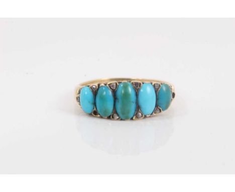 Late Victorian turquoise and diamond ring with five graduated turquoise cabochons with rose cut diamonds to the claws, carved