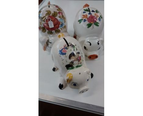 Three large ceramic pig money bank, largest 22cm 