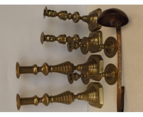 Three pairs of brass candlesticks together with a brass and copper bowled ladle, height of largest candlesticks 31cm 