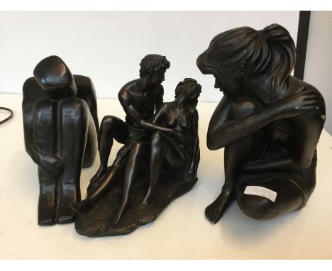 Two resin figures and a ceramic figure 