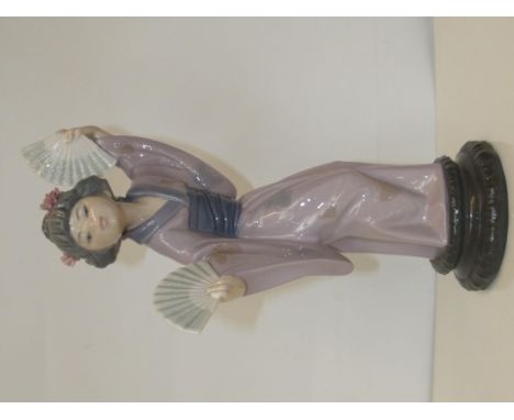 Lladro figure of a Geisha, modelled holding two fans, height 30cm
