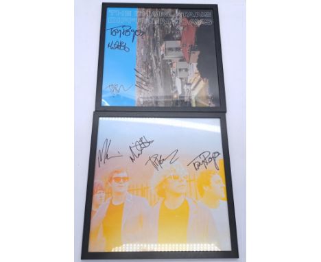 A pair of The Charlatans framed prints (appearing fully signed by the band) to include; a print picture of the band and the c