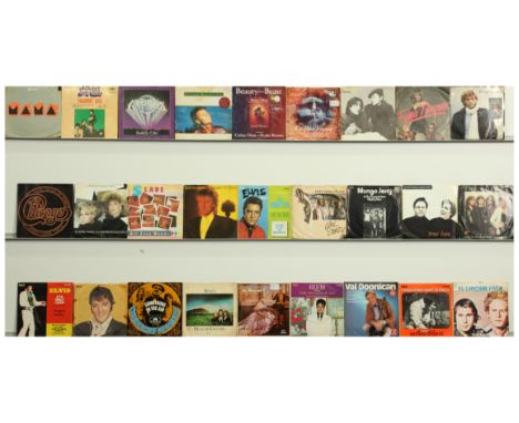 A collection of Pop Chart Hits 7" Singles from 1950s to 1970's. Includes artists Elvis Presley, Elton John and similar. Some 
