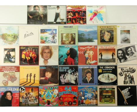 A collection of Classical and 1970's Rock And Pop LPs. Includes artists: The Osmonds, Barry Manilow, The Nolans, Chris De Bur