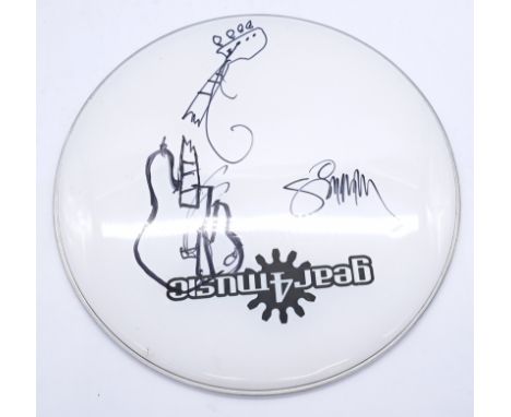 Paul Simonon signed drum skin. Signature on skin is of original The Clash bass player Paul Siminon and has the sketch of his 
