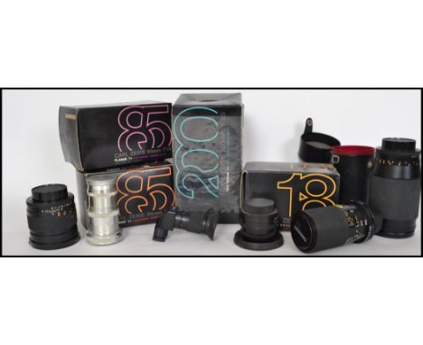 A collection of vintage / retro 20th century camera lenses predominately Carl Zeiss Contax  to include a Planer 1.4/85, Plane