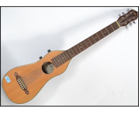 A contemporary electric Ashbury acoustic guitar model STR-100 having a mandolin shaped body with a rosewood neck and mother o