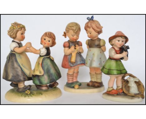 2 large vintage Goebel West German Hummel figurines to include Knitting Lesson &  Spring Dance together with anotther similar