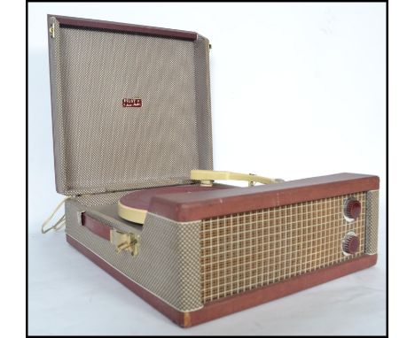 A retro 20th century 4 speed record player in the original case  by Pilot