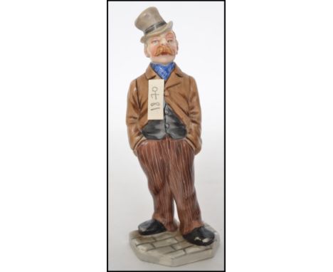 A 19th century Royal Worcester ceramic figure in the form of a gentleman with impressed mark to base. Measures 13cms high.