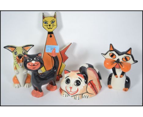 A group of Lorna Bailey ceramic cats all signed to include standing, seated, and a Purrdy wall plaque. Tallest measures 18cms