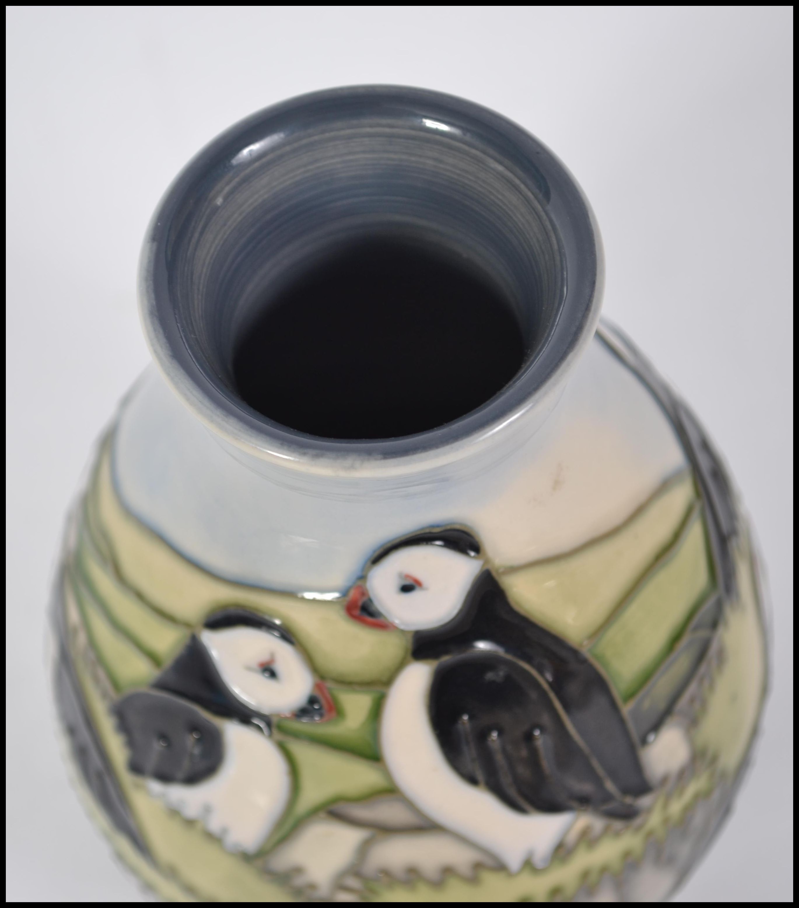 A Moorcroft Pottery Puffin pattern baluster vase decorated with puffins