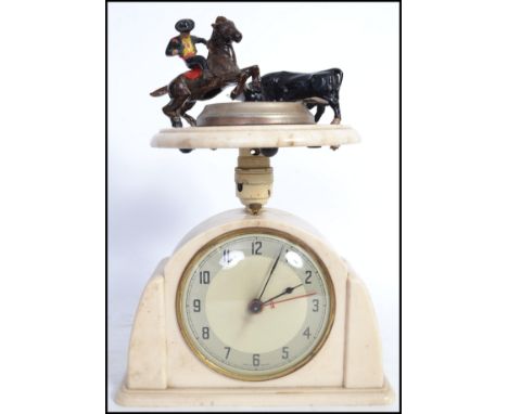 A vintage 20th century ashtray with mounted matador and bull figure to top raised on a circular marble plinth base along with