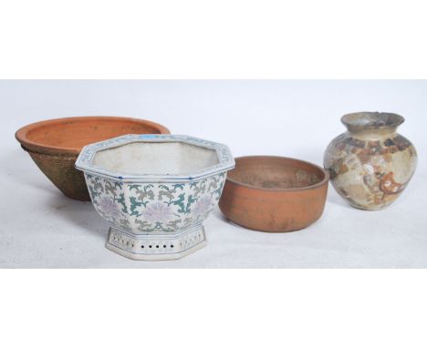 A group of 4 ceramic garden planters, one blue and white in Oriental form and the others of traditional form. Please see imag