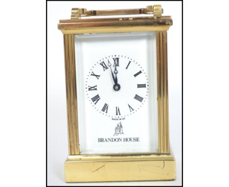 A vintage 20th century brass cased carriage clock having a Fema London 11 jewel movement with faceted hands and a Roman numer