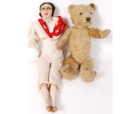 A collection of 2x vintage toys to include; a 1930's Norah Wellings style doll of a woman with red scarf (measures approx 57c