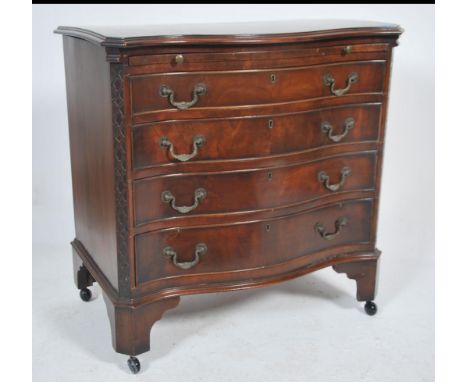  A mahogany serpentine fronted bachelors chest of drawers being raised on bracket feet having a central serpentine fronted ba