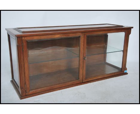 A good Victorian mahogany shop display - haberdashery cabinet of long form with twin doors and bevelled glass windows. Lined 