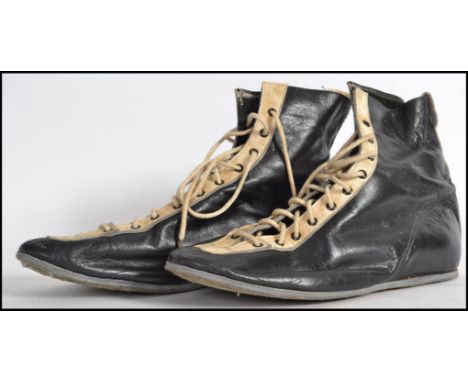 A vintage  20th century pair of leather upholstered two tone blue  and white boxing boots complete with the laces being a siz
