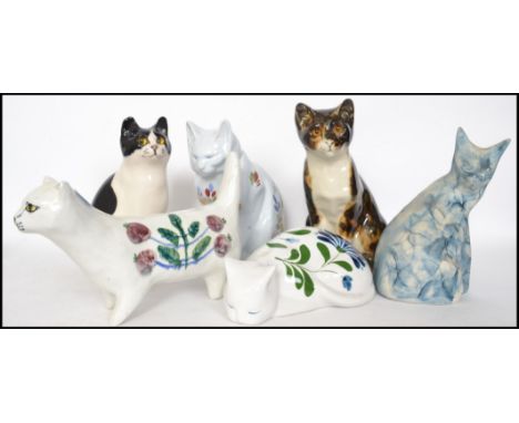 A group of ceramic cats to include a HB Henriot Quimper cat, a Dansk cat, a large Minton cat with glass eyes, Cotswold potter