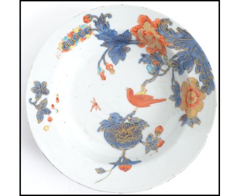 A believed 18th century Oriental blue and white ceramic bowl, with red and gilt detailing depicting birds and flowers. Measur