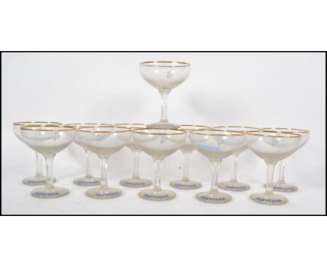 A set of 12 vintage 1950s hexagonal stem Babycham glasses with white fawns. Measures 11cms high.