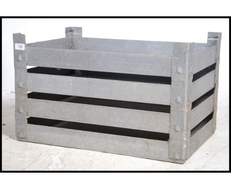 A set of four vintage industrial aluminium stacking tote trays, each with twin carry rails. Measures height 38cm x width 62cm