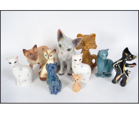 A collection of cat figurines to include a good Studio pottery cat Devon Rex signed BT together with Poole Pottery cats, Sylv