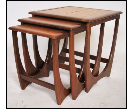 A retro 1960/70s G-Plan teak wood and tile top nest of tables. Raised on squared legs with returns, the top table with tile t
