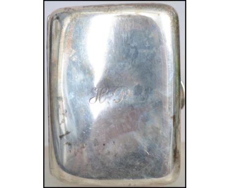 An Edwardian silver hallmarked cigarette case having central monogram for HP to centre. Hallmarked for Colin Hewer Cheshire, 