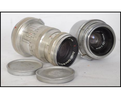 A vintage Zeiss-Opton Biogon T f/2.8 35mm Lens, chrome, serial no. 2203286 together with a Carl Zeiss Jena Triotar f/4.5 75mm