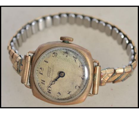 A vintage early 20th century ladies 9ct gold / 375 marked dress watch by Tissot on expanding bracelet. Total weight 22.5g