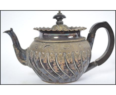 An unusual Victorian silver plated teapot by James Dixon & Sons of good quality bearing inscription to the base for ' Present