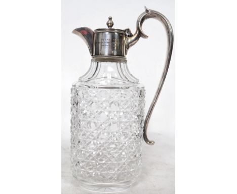 Greyhound Racing Interest. A silver plated and cut glass claret jug decanter with notation to the collar for the Greyhound Ra