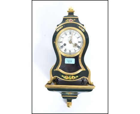 A good French style lacquered mantel clock by Schmid. The 8 day movement striking on a ball with decorative case with glass p