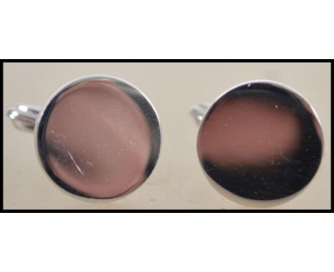 A pair of gentleman's silver cufflinks complete in the presentation case